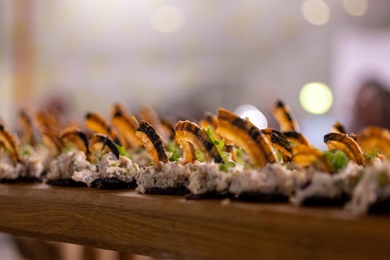 Greenlandic seafood snacks, such as deep fried mattaq (whale blubber) and seasoned fish skin crisps.
